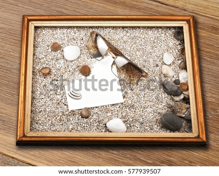 Shells, starfish ,blank paper sheet ,sunglasses and frame