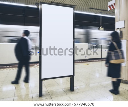 Blank Billboard Banner in Subway station with blurred people Travel