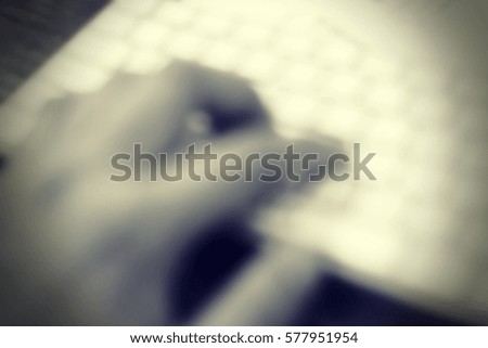Blurred  background abstract and can be illustration to article of hand typing on keyboard