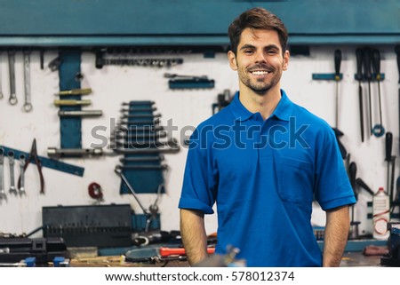 Portrait of Car Mechanic Man in Garage.