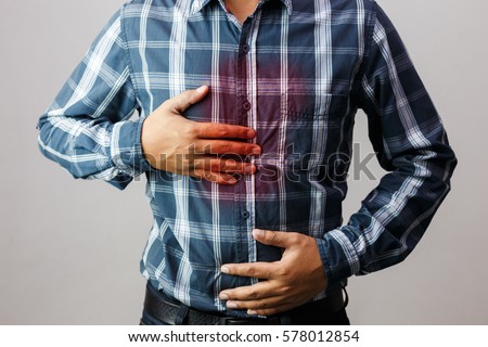  Men have symptoms of burning sensation in the middle of the chest caused by acid reflux. /Health and medical concepts. Royalty-Free Stock Photo #578012854
