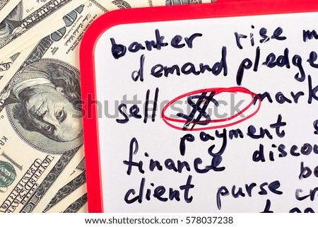 Clipboard with text and dollars. Business plan of development.