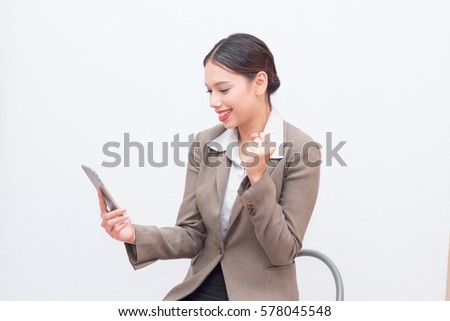 Businesswoman use of mobile phone. young woman used smart phone and tablet. business woman in the moment of success