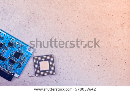 top view of electronic board and microprocessor on kraft paper background in bi colors