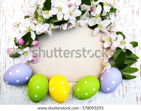 Easter eggs, spring apple blossom and greeting card