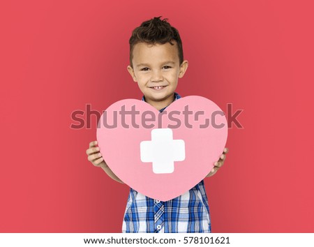 Little Children Holding Red Cross Heart