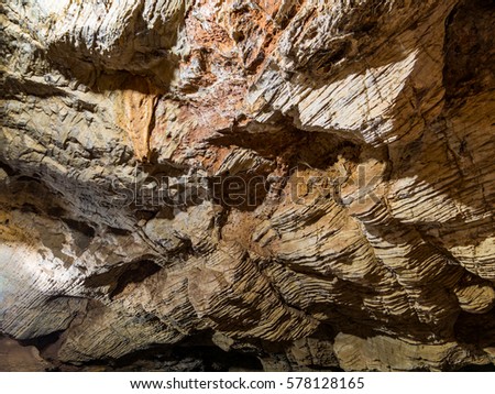 Rocky pattern in tranquil cave in deep forest