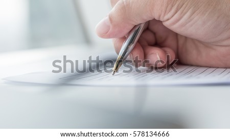 Applicant filling in business company application form document applying for job, or registering claim for health insurance Royalty-Free Stock Photo #578134666