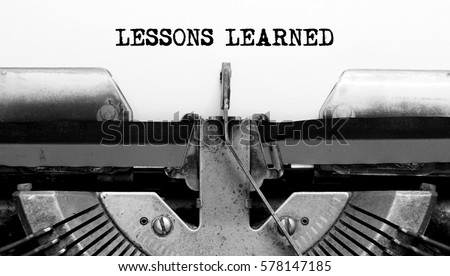 Vintage Typewriter with text LESSONS LEARNED Royalty-Free Stock Photo #578147185