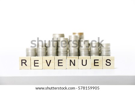 REVENUES text made with wood blocks.Business Concept 