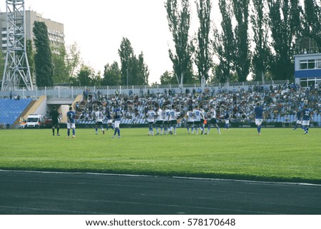 Football match in sunny summer day