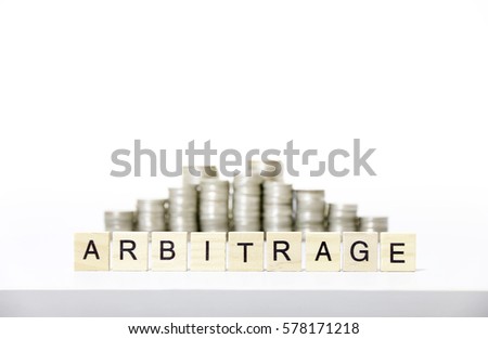 ARBITRAGE text made with wood blocks.Business Concept . Royalty-Free Stock Photo #578171218