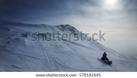 Snowmobile in snowy scenery 