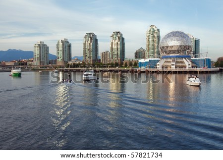 View of the Vancouver skyline of Science World and nearby buildings from the water of False Creek