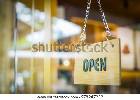 Open sign door in the coffe shop.