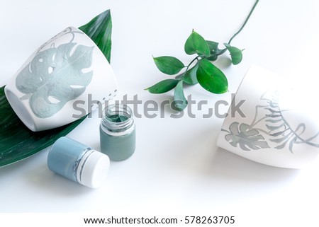 painted ceramic cup on white background