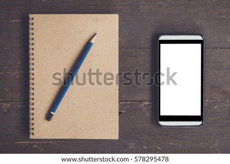 Blank notebook and phone blank screen for advertising on wood table background with space.