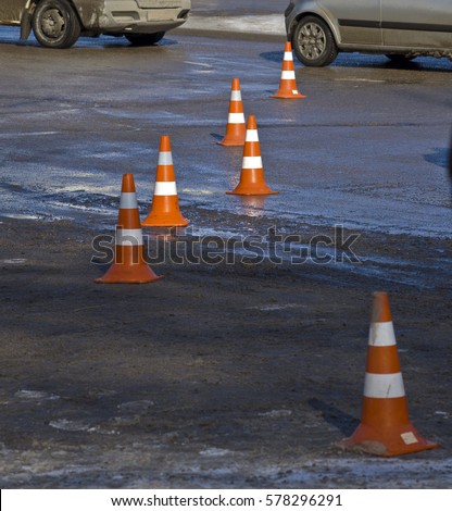 Road hazard cone on accident site. Traffic control