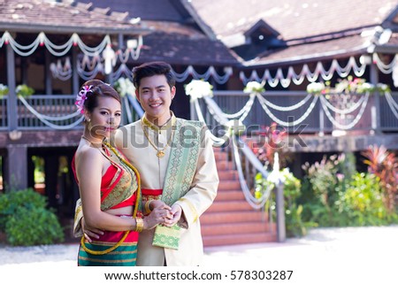 Thai women and Men with traditional Thai suit. wedding dress. Beauty Fashion Hairstyle Makeup photo shoot Wedding.