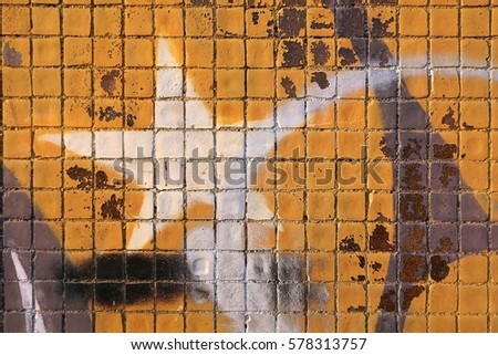 Painted mosaic brick tile wall, close up of graffiti texture, with vibrant colors for creativity, imaginative backgrounds and ideas.