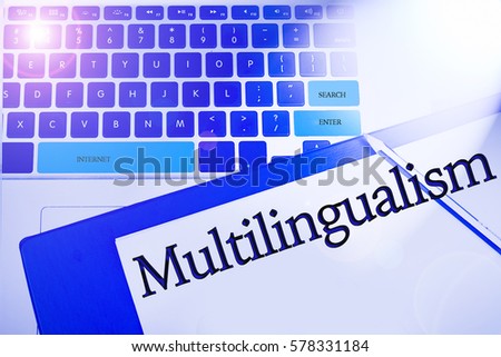 Multilingualism word in business concepts, technology background in laptop and notepad