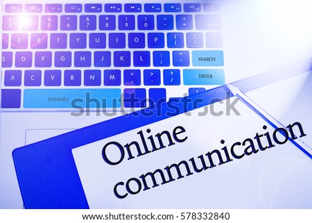 Online Communication word in business concepts, technology background in laptop and notepad