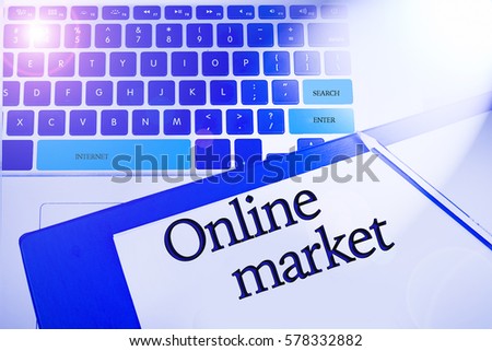 Online market, word in business concepts, technology background in laptop and notepad