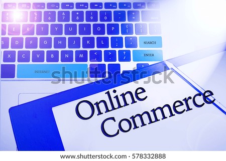Online Commerce word in business concepts, technology background in laptop and notepad