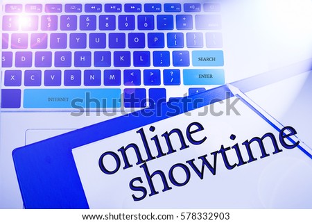 Online Showtime word in business concepts, technology background in laptop and notepad
