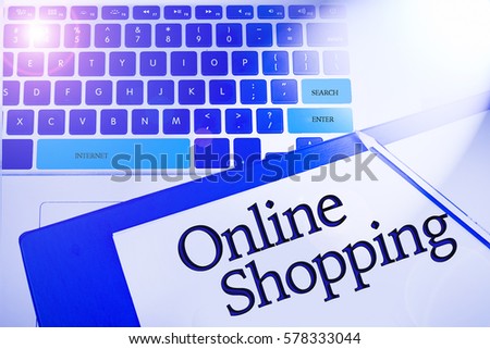 Online shopping word in business concepts, technology background in laptop and notepad