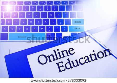 Online Education word in business concepts, technology background in laptop and notepad