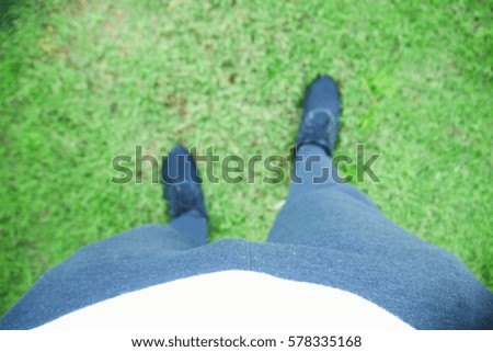 Picture blurred  for background abstract and can be illustration to article of people standing on grass