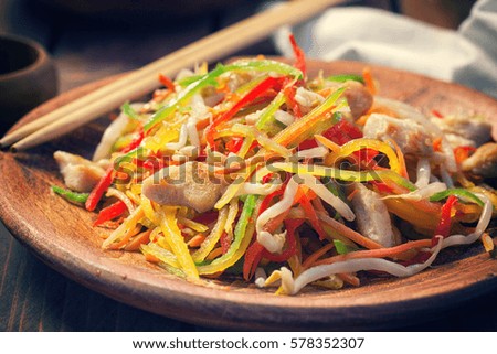 Stir fry chicken meat with vegetables and sprouts 