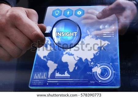 Business, Technology, Internet and network concept. Young businessman showing a word in a virtual tablet of the future: Insight