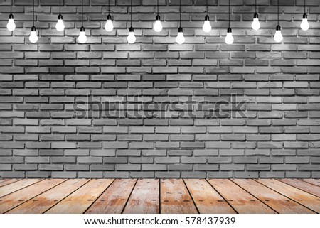 brick wall with bulb lights lamp. nice brick show room with spotlights. concept background