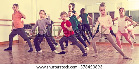 Little boys and girls dancing contemp dance in studio