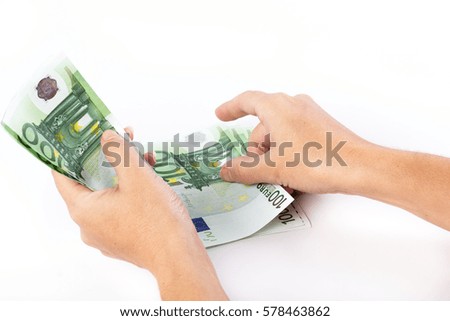 Close up of female hands counting 100 euro banknotes isolated on white background