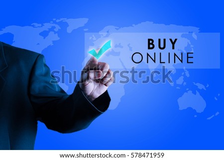a business man touching a imaginary screen with text BUY ONLINE