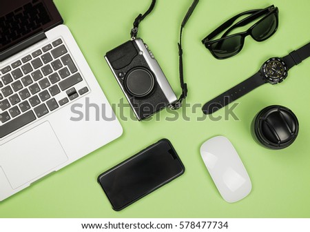 Flat lay style picture of workspace with office supplies on pastel colored background. Top view