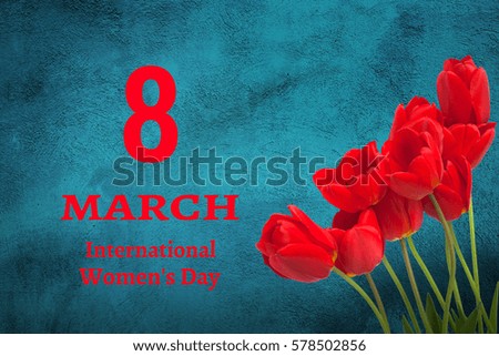 Beautiful Card with text March 8 International Women's Day. Red Tulips Flowers on turquoise Textured Background. Horizontal Image