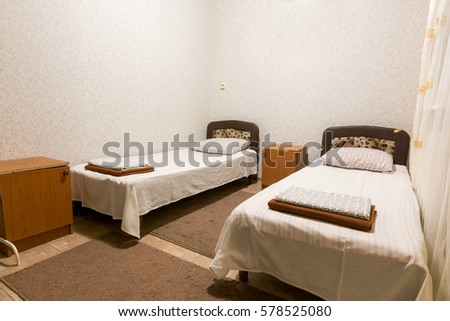 The interior of a small room with two beds Royalty-Free Stock Photo #578525080