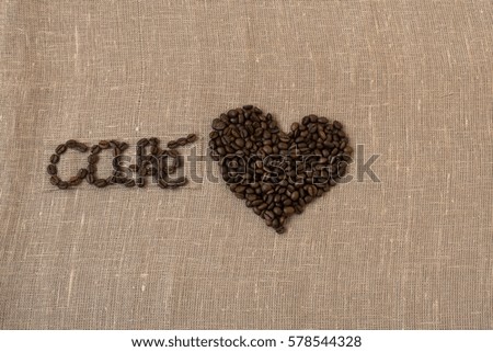 Roasted coffee beans, flax, the word coffee in French, coffee, card, in Spanish,  heart, 