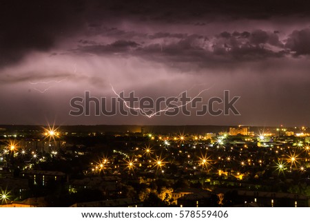 Lightning over night town.