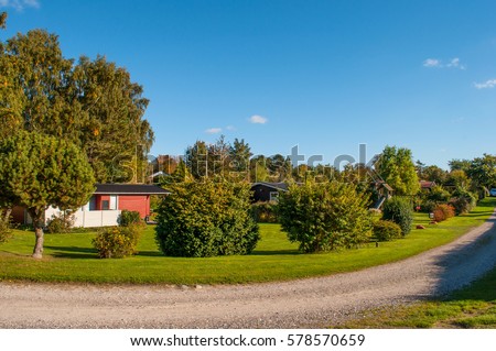 summer homes on Bogoe in Denmark  Royalty-Free Stock Photo #578570659