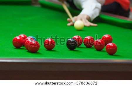 Red Ball and Snooker Player, man play snooker Royalty-Free Stock Photo #578606872