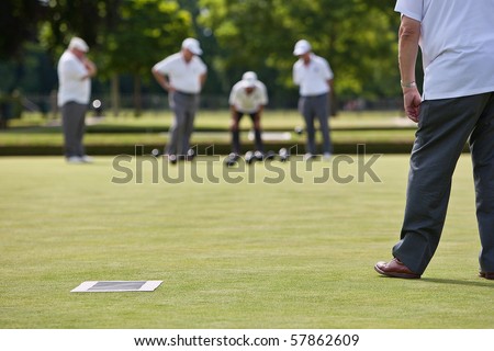 Men playing lawn bowls. Narrow depth of field.