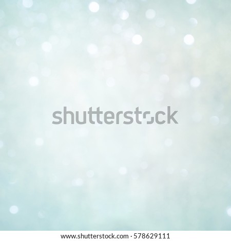 Delicate background for design. Beautiful light Blue Holiday Texture with Bokeh lights. Winter Christmas Backdrop with tinted edges. Square Wallpaper Web Banner With Copy Space.