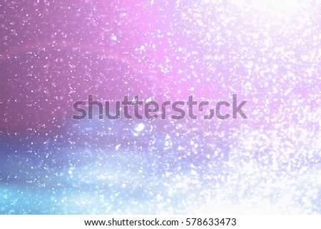 Magic festive pink or serenity background. Bokeh light and sparkles. Abstract glitter lights.