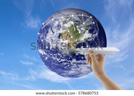plane in hand with globe on background, Map world of flight routes airplanes network use for global travel, import,export,logistics network concept, Elements of this image furnished by NASA