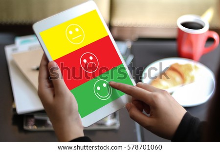 business man select happy on satisfaction evaluation? And good mood smiley Royalty-Free Stock Photo #578701060